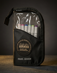 Front view of the Knightshift black zipper pouch with assorted markers against a charcoal-and-gold background.
