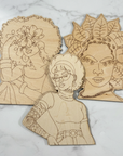 Three Roots wooden portrait cutouts on a white marble background